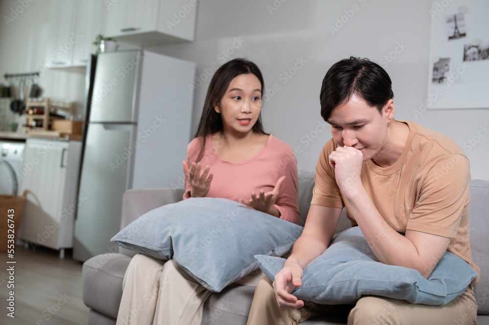 Young married couple asian husband and wife are arguing, angry couple ignoring each other, relationship trouble concept... Young married couple asian husband and wife are arguing, angry couple ignoring each other, relationship trouble concept...