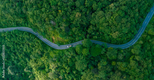 Aerial view of  road in the middle of the forest , Top view road curve construction up to mountain, Rainforest ecosystem and healthy environment concept © Hand Robot