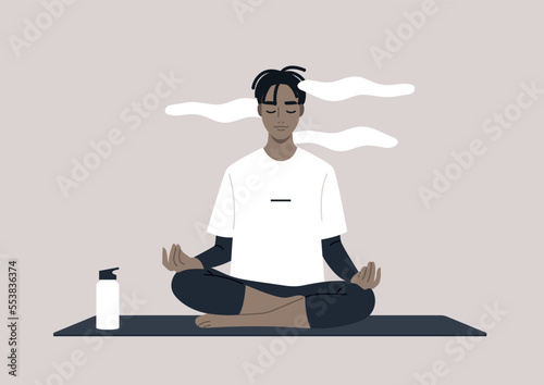 Young calm male African character meditating in a lotus yoga pose, a mindful lifestyle concept