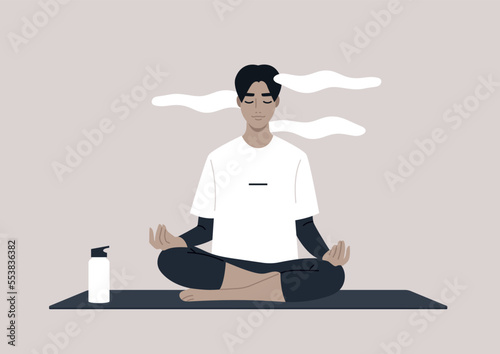 Young calm male character meditating in a lotus yoga pose, a mindful lifestyle concept