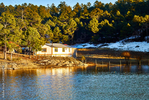 lake on winter with snow and beautiful forest in the background, arareco lake in creel chihuahua  photo