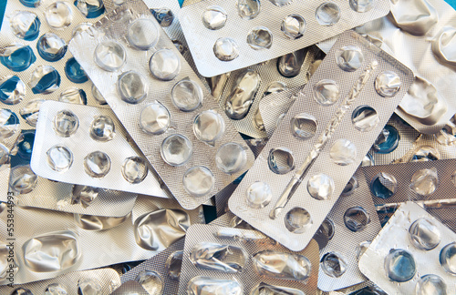 empty used pillboxes blank plates from pills, pharmaceutical background