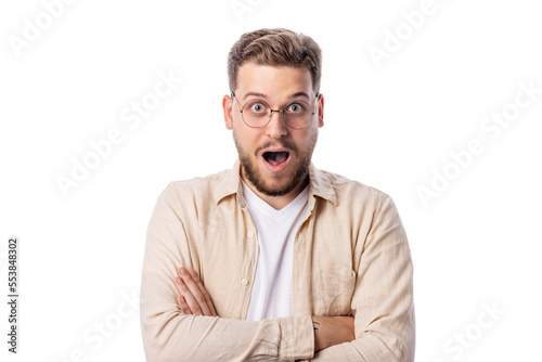 Shoked caucasian male on white background with hands crossed on the chest looking to camera photo