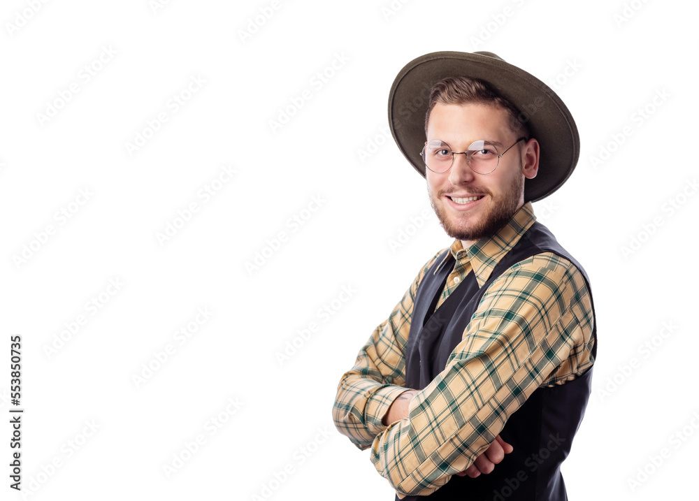 Young european man in eyewear, trendy cowboy hat and shirt with hands crossed on chest looking to camera and smiling Young european man in eyewear, trendy cowboy hat and shirt with hands crossed on chest looking to camera and smiling