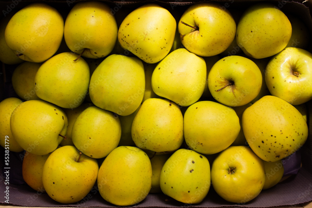 close-up top view crate of golden apples