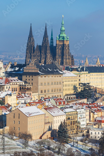 Snowy Prague City with gothic Castle from Hill Petrin in the sunny Day, Czech republic