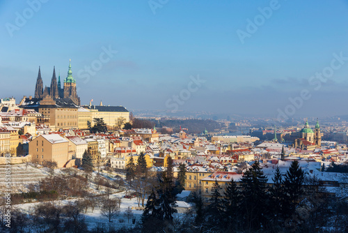 Snowy Prague City with gothic Castle from Hill Petrin in the sunny Day, Czech republic © Kajano