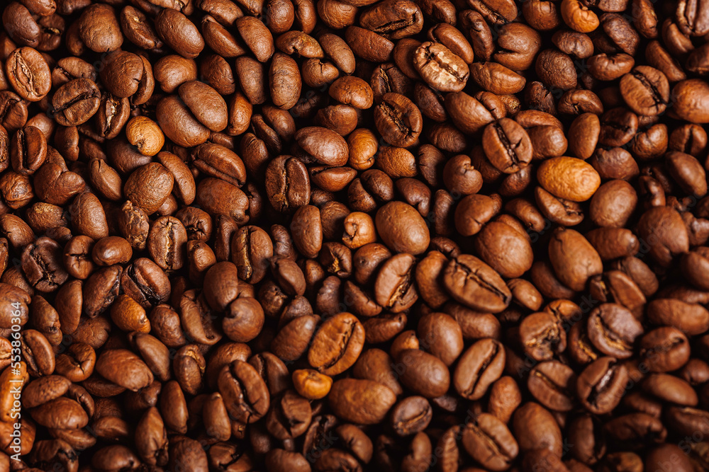 Brown background arabica coffee beans for espresso
