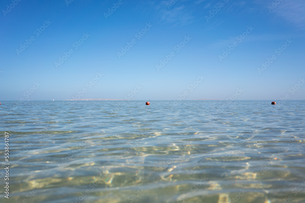 the red sea is the saltiest sea in the world, you can see the bottom of the sea through the water, a shot from a low angle
