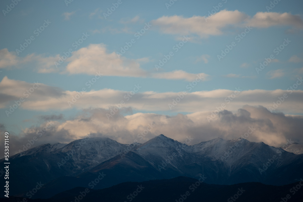 Clouds over the snowy mountains 2