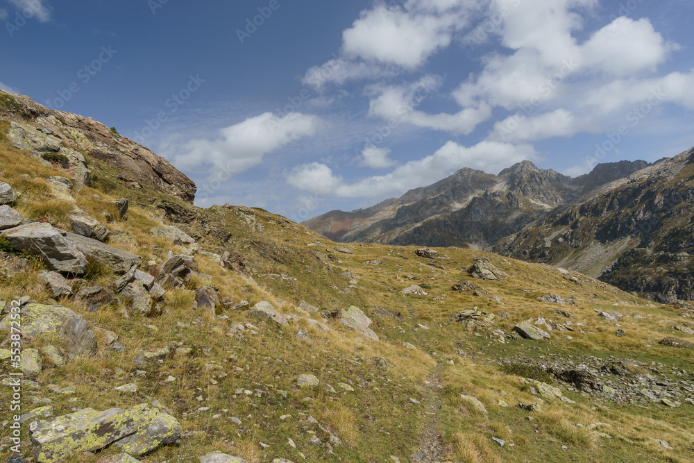 Beautiful pyrenees mountain landscape of Vallee du Soussoueou with hiking footpath on a beautiful autumn day, Artouste, Nouvelle-Aquitaine, France