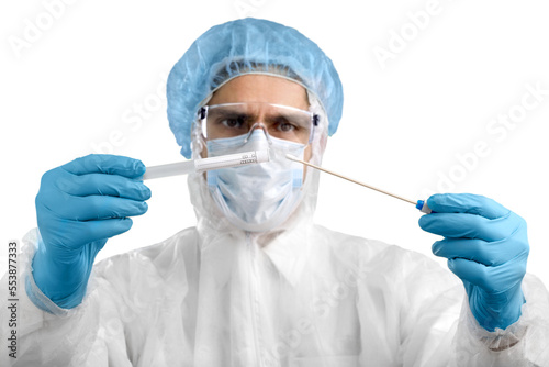 Medical healthcare technologist holding COVID-19 swab kit  wearing white protective suit and mask