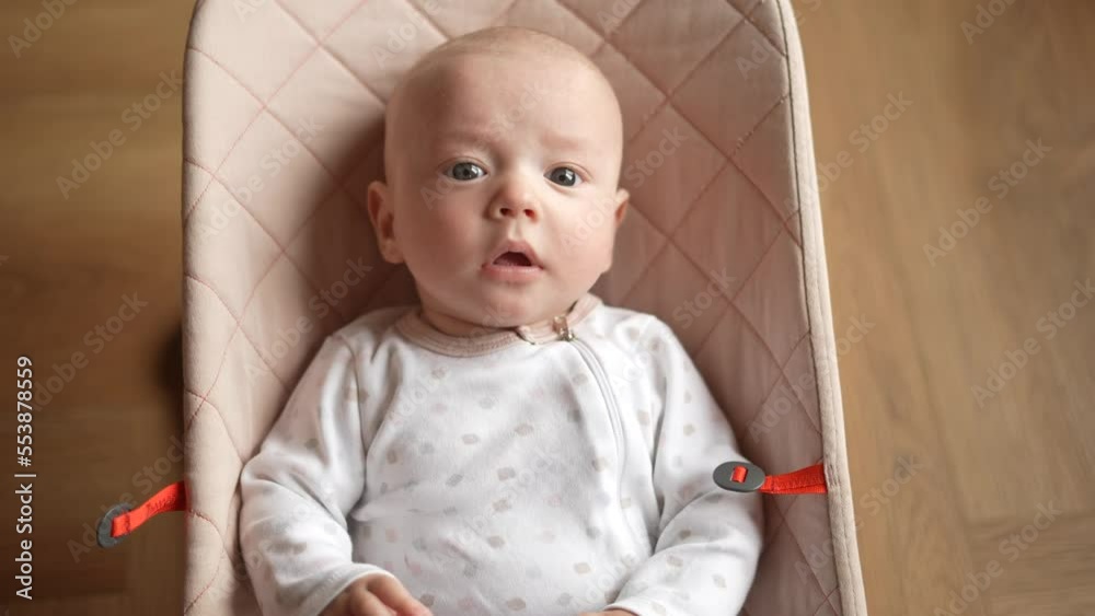 newborn baby in a rocking chair. happy family kid dream concept ...