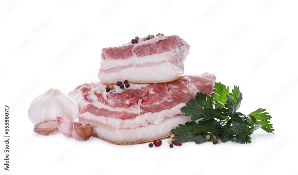 Pieces of pork fatback served with different ingredients isolated on white Pieces of pork fatback served with different ingredients isolated on white