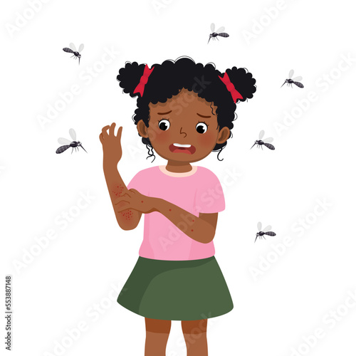 cute little African girl scratching her itchy rash and swelling arm allergy from mosquitoes and insects bites