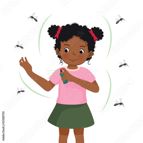 Cute little African girl applying insect repellent spray to her arm as protection against mosquitoes