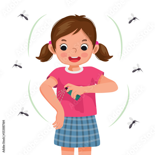 Cute little girl applying insect repellent spray to her arm as protection against mosquitoes