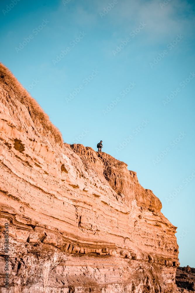 climber on the top of cliff