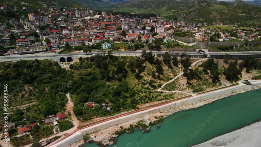 Aerial shot of residential and river in Tepelena city, Albania. mountains view. Aerial shot of residential and river in Tepelena city, Albania. mountains view.