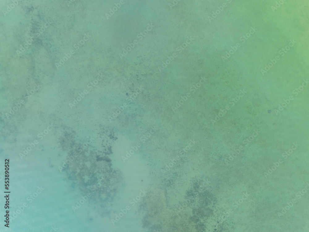 Top view of green sea surface, Shot in the open sea from above,Amazing nature background of Turquoise Water surface waves reflecting the Sunlight Top view of green sea surface, Shot in the open sea from above,Amazing nature background of Turquoise Water surface waves reflecting the Sunlight