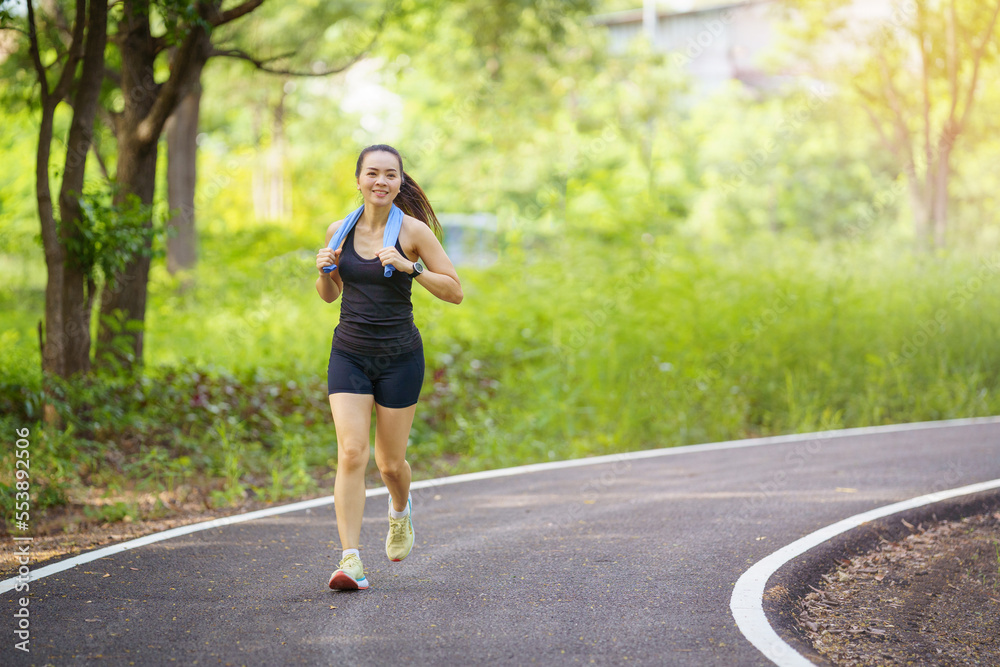 Healthy beautiful young runner woman in sports outfits workout outdoors in the park in the evening Healthy beautiful young runner woman in sports outfits workout outdoors in the park in the evening