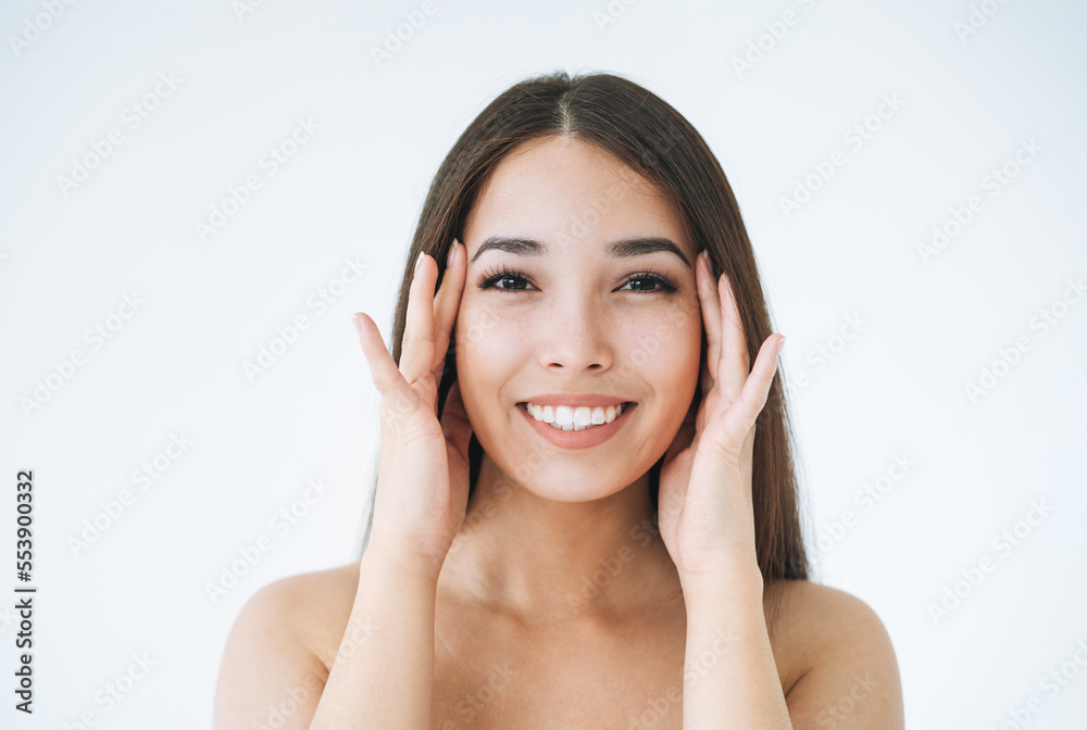 Beauty portrait of young asian woman with healthy dark long hair on white background isolated Beauty portrait of young asian woman with healthy dark long hair on white background isolated