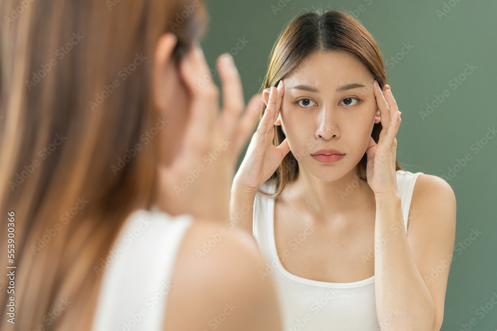 Dermatology, puberty asian young woman, girl face worry looking mirror, allergic reaction from cosmetic, red or dark spot, rash. Beauty care from skin problem treatment, blemish wrinkle from sunlight. Dermatology, puberty asian young woman, girl face worry looking mirror, allergic reaction from cosmetic, red or dark spot, rash. Beauty care from skin problem treatment, blemish wrinkle from sunlight.