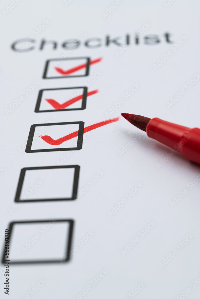 Red pen marking on checklist sheet Red pen marking on checklist sheet
