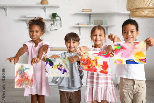 Little children with painti...