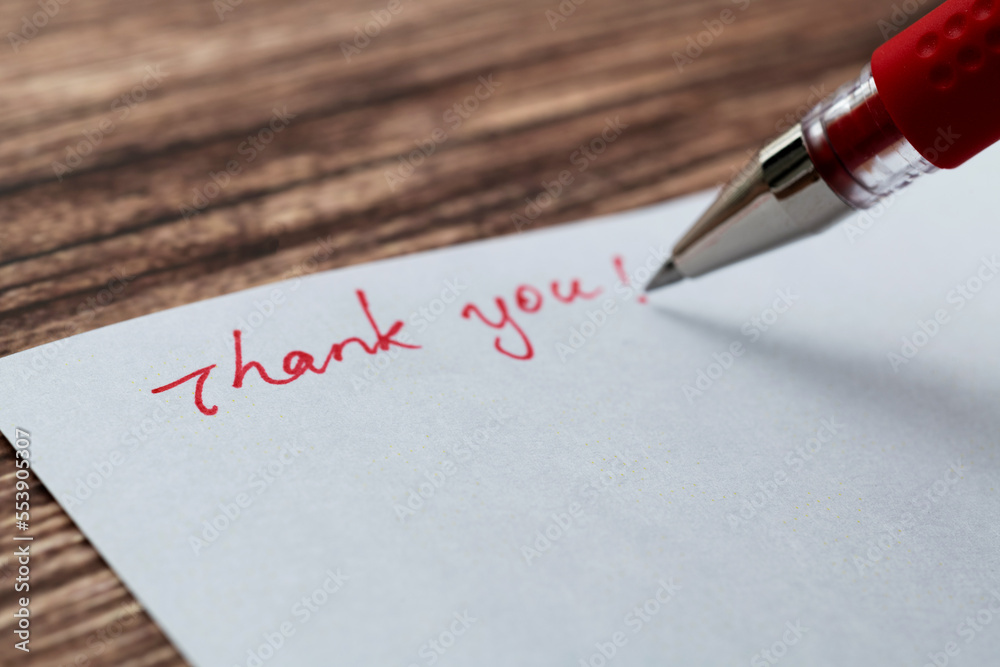 Fototapeta premium Writing thank you on white paper