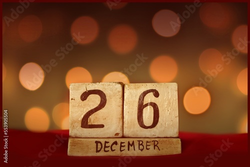 26 December block calendar, bokeh lights background photo
