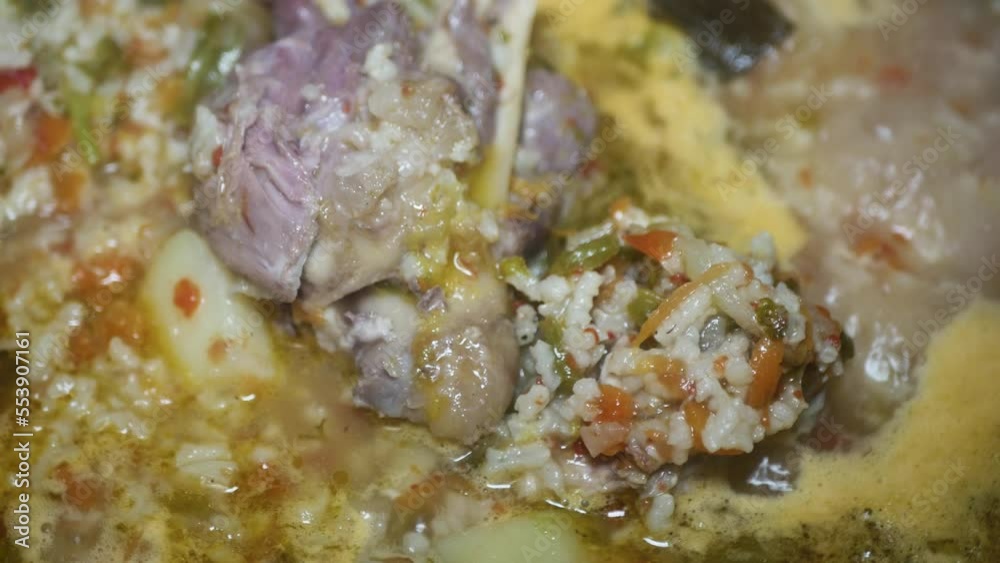 kharcho soup with lamb meat with bone and rice, macro
kharcho soup with lamb meat with bone and rice, macro