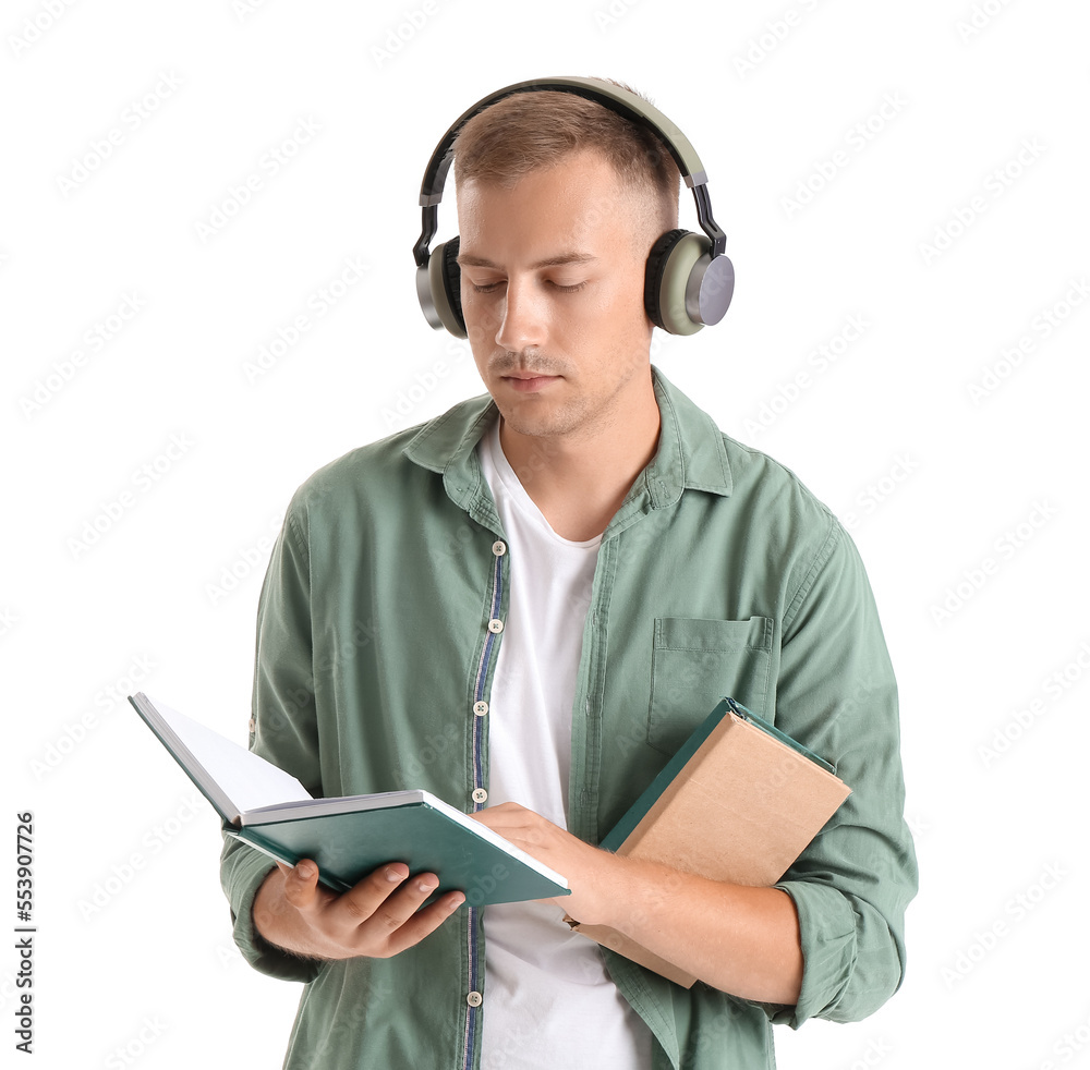 Young man with headphones and books on white background. Online education Young man with headphones and books on white background. Online education