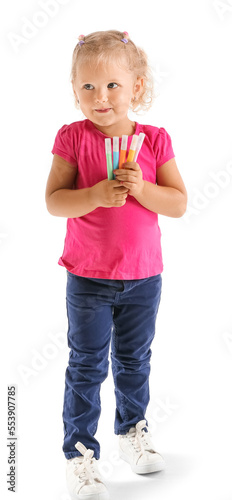 Smiling little girl holding...