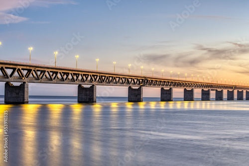 Part of the famous Oresund bridge between Denmark and Sweden after sunset photo