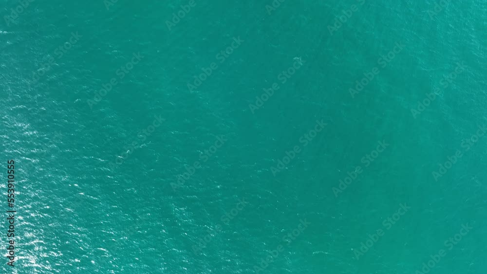 Texture of sea waves water surface, Dynamic shot Aerial view of green sea surface at Phuket Thailand, Beautiful waves sea surface seashore Amazing nature and travel background Texture of sea waves water surface, Dynamic shot Aerial view of green sea surface at Phuket Thailand, Beautiful waves sea surface seashore Amazing nature and travel background