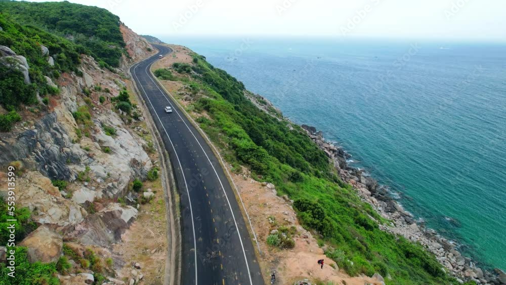 Landscape Vung Ro Bay in the morning with a spectacular pass road winding around the coastal mountainside. This place is considered the most beautiful bay in central Vietnam Landscape Vung Ro Bay in the morning with a spectacular pass road winding around the coastal mountainside. This place is considered the most beautiful bay in central Vietnam
