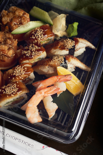 Set of different sushi and rolls wood desk top view nature food chopstick japan traditional fish tasty closeup