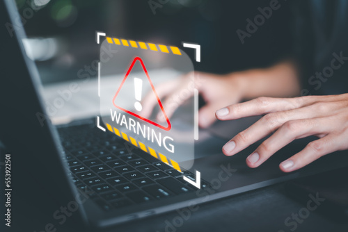 Businessman using a laptop to work,alert and foreign body detection,spyware virus,internet network security concept,cyber security auditing system,Alerts to watch out for danger