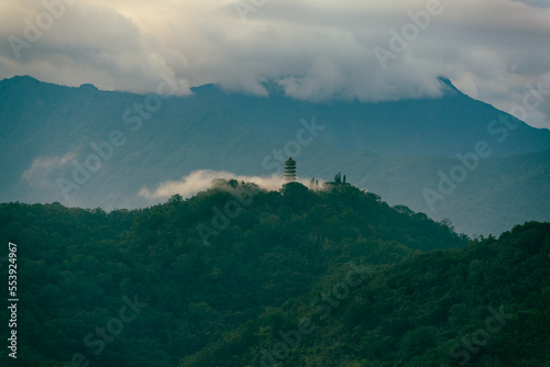The temple on the mountain was covered by early morning clouds. Chaowu Pier, Sun Moon Lake National Scenic Area. Nantou County, Taiwan