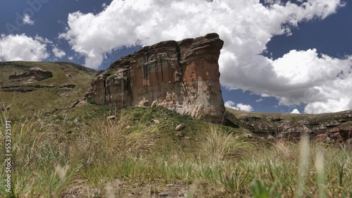 Time-lapse clouds billow over Brandwag Sentinel cliff in South Africa photo