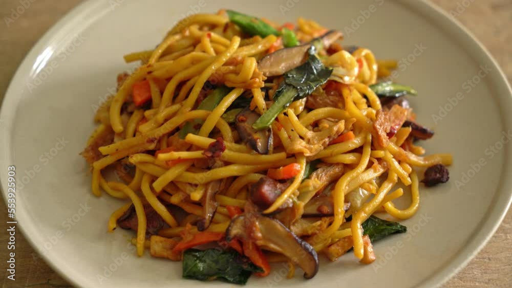 stir-fried yakisoba noodles with vegetable in vegan style - Vegan and vegetarian food style stir-fried yakisoba noodles with vegetable in vegan style - Vegan and vegetarian food style