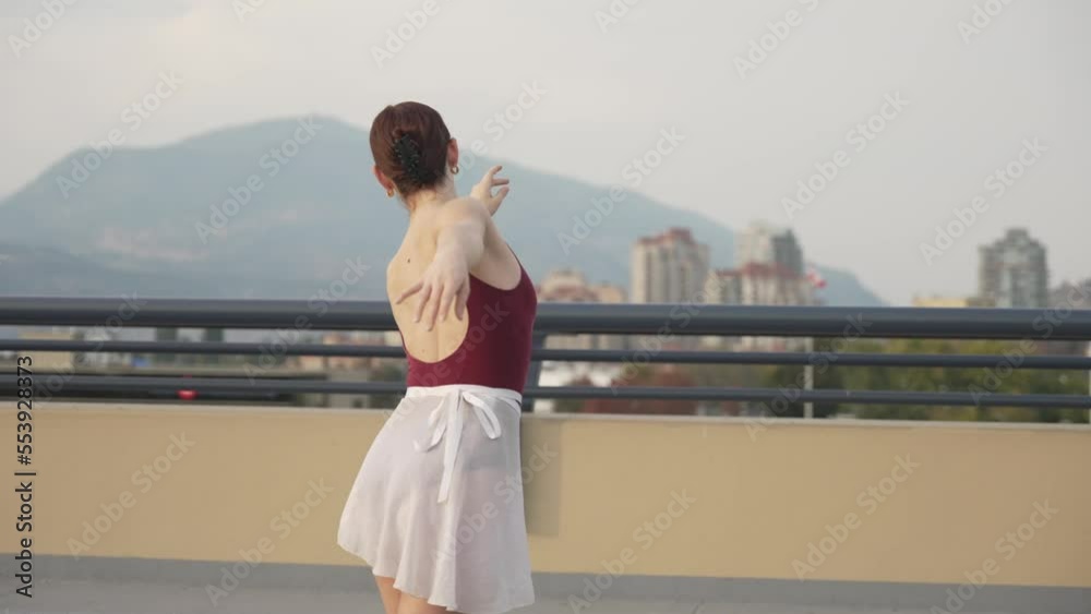 Outside ballet dancing alone on a roof top Outside ballet dancing alone on a roof top