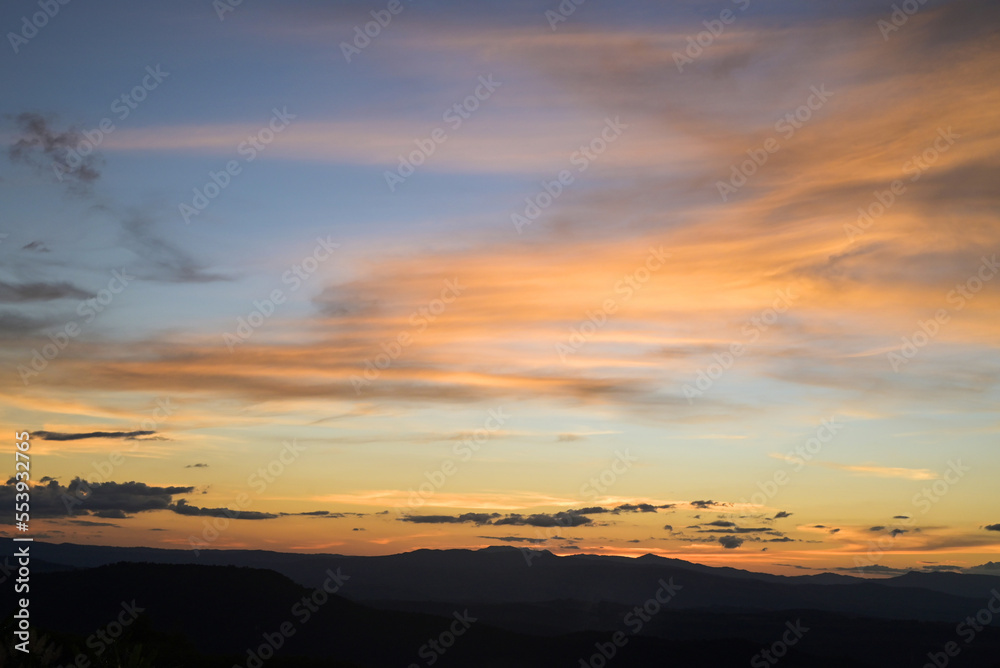 Sunrise or sunset, beautiful sky sunlight shines sky with clouds colorful and mountain background - Twilight cloud on sky Sunrise or sunset, beautiful sky sunlight shines sky with clouds colorful and mountain background - Twilight cloud on sky