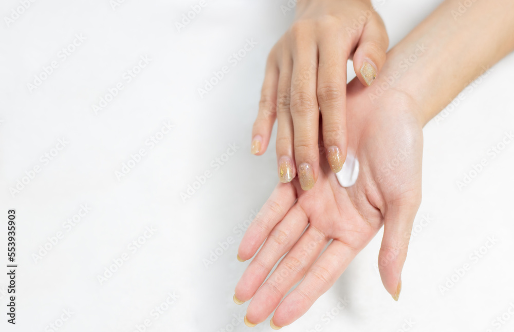Woman applying cream on clean hand for beauty and spa treatment skin care on white background. Woman applying cream on clean hand for beauty and spa treatment skin care on white background.