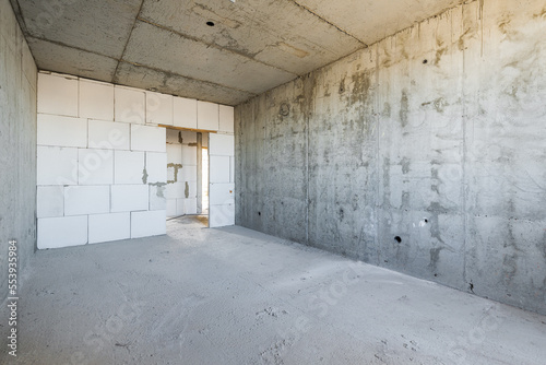 Empty concrete commercial space without finishing with partitions