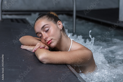 Relaxed woman during hydrotherapy session in pool