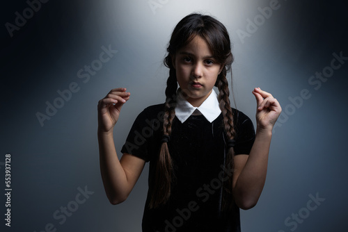 Photography Portrait of little girl with Wednesday costume during Halloween