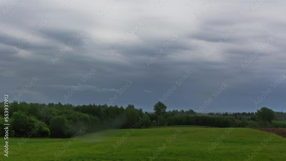 TImelapse in a Green Meadow on A Wintery Wet Day with Moody Clouds TImelapse in a Green Meadow on A Wintery Wet Day with Moody Clouds