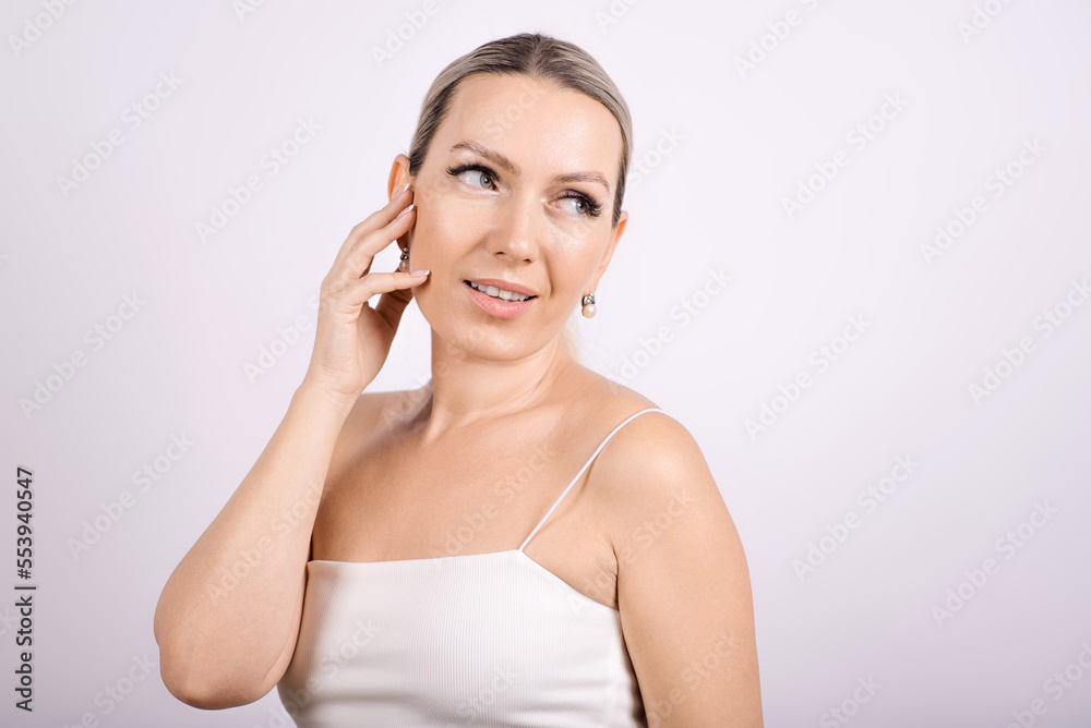 Portrait of a beautiful woman on a white background. The concept of skin care. Portrait of a beautiful woman on a white background. The concept of skin care.